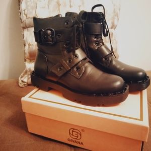 Givana black size 9 boots laced with buckles and straps.
